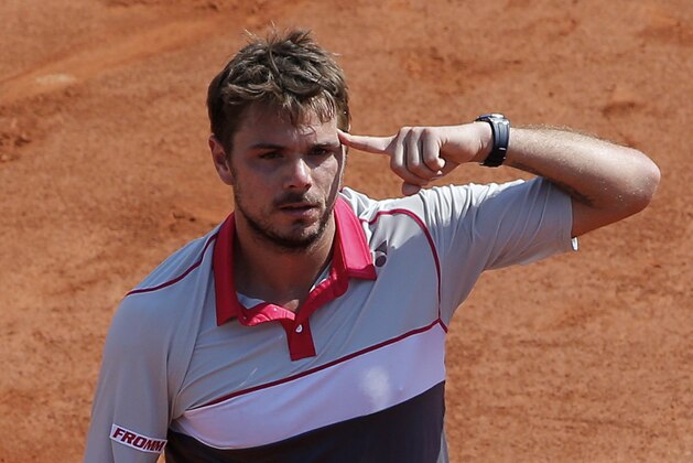 Switzerland's Stan Wawrinka reacts after defeating France's Jo-Wilfried Tsonga during their semifinal match of the French Open tennis tournament at the Roland Garros stadium, Friday, June 5, 2015 in Paris. Wawrinka won 6-3, 6-7, 7-6, 6-4. (AP Photo/Christophe Ena)