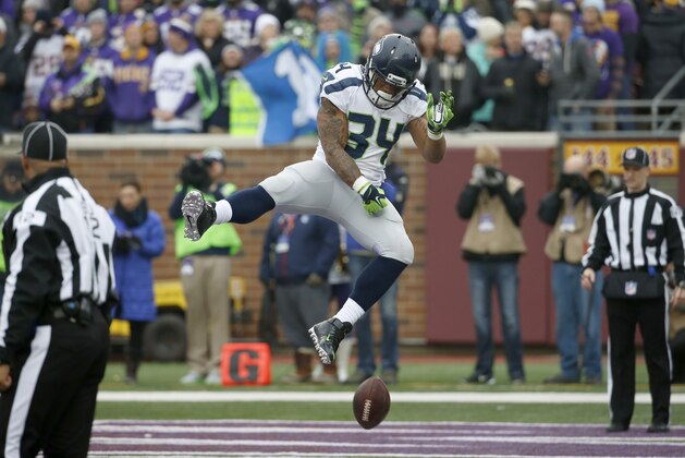 Seattle Seahawks running back Thomas Rawls  celebrates his five-yard touchdown run against the Minnesota Vikings in the first half of an NFL football game Sunday, Dec. 6, 2015 in Minneapolis. (AP Photo/Ann Heisenfelt)