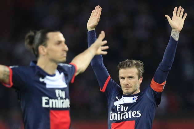 Paris Saint Germain's midfielder David Beckham from England, right, celebrates after Paris Saint Germain's forward Zlatan Ibrahimovic from Sweden, left, scores during their French League One soccer match against Brest, at the Parc des Princes stadium, in Paris, Saturday, May 18, 2013. Paris Saint-Germain hopes to strike a deal with David Beckham in the next two weeks in which the former England captain will work with the French club after retirement, possibly in an ambassadorial role. (AP Photo/Thibault Camus)