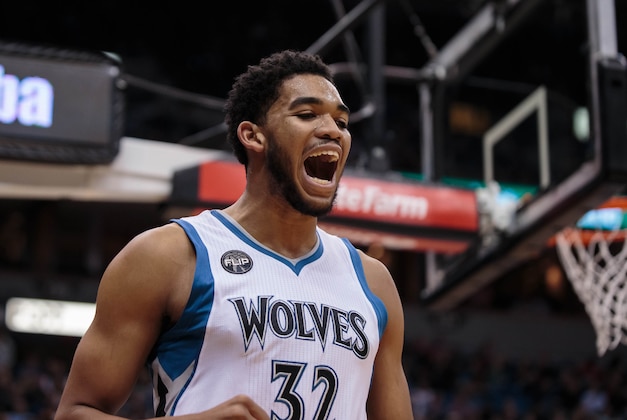 Nov 12, 2015; Minneapolis, MN, USA; Minnesota Timberwolves center Karl-Anthony Towns (32) reacts to a foul in the first quarter against the Golden State Warriors at Target Center. Mandatory Credit: Brad Rempel-USA TODAY Sports