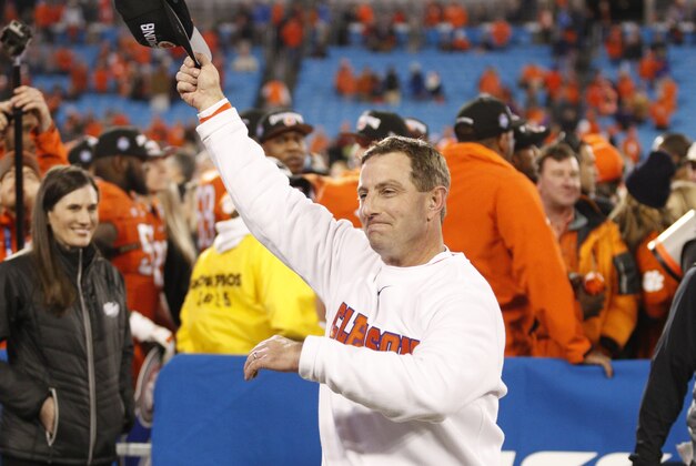Clemson coach Dabo Swinney celebrates after Clemson defeated North Carolina 45-37 in the Atlantic Coast Conference championship NCAA college football game in Charlotte, N.C., Sunday, Dec. 6, 2015. (AP Photo/Bob Leverone)