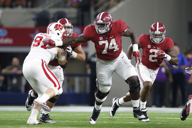 Sep 5, 2015; Arlington, TX, USA; Alabama Crimson Tide tackle Cam Robinson (74) in action against the Wisconsin Badgers at AT&T Stadium. Mandatory Credit: Matthew Emmons-USA TODAY Sports
