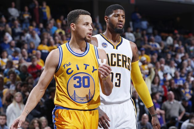 INDIANAPOLIS, IN - DECEMBER 8: Stephen Curry #30 of the Golden State Warriors stands alongside Paul George #13 of the Indiana Pacers during a game at Bankers Life Fieldhouse on December 8, 2015 in Indianapolis, Indiana. The Warriors defeated the Pacers 131-123. NOTE TO USER: User expressly acknowledges and agrees that, by downloading and or using the photograph, User is consenting to the terms and conditions of the Getty Images License Agreement. (Photo by Joe Robbins/Getty Images)