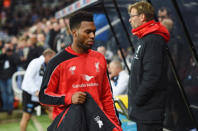 NEWCASTLE UPON TYNE, ENGLAND - DECEMBER 06:  Substitute Daniel Sturridge of Liverpool walks to the bench past Jurgen Klopp manager of Liverpool prior to the Barclays Premier League match between Newcastle United and Liverpool at St James' Park on December 6, 2015 in Newcastle upon Tyne, England  (Photo by Michael Regan/Getty Images)
