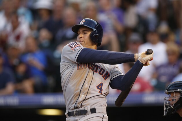 Houston Astros right fielder George Springer bats against the Colorado Rockies during the fourth inning of an interleague baseball game Wednesday, June 17, 2015, in Denver. (AP Photo/David Zalubowski)
