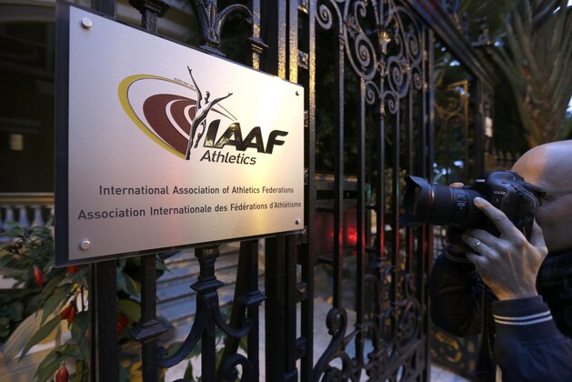 A photographer pictures the logo at the IAAF (International Amateur Athletic Federation) headquarters in Monaco, Friday, Nov 13, 2015. IAAF leaders are set to suspend the Russian federation, keeping the country's track and field athletes out of international competition for an indefinite period that could include next year's Olympics in Brazil. (AP Photo/Lionel Cironneau)