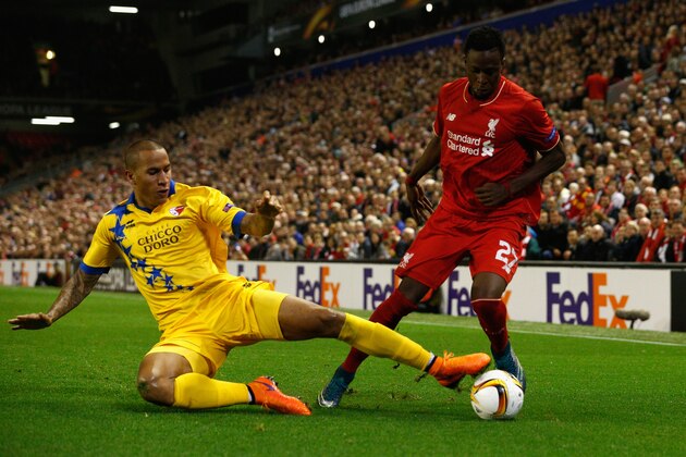 LIVERPOOL, ENGLAND - OCTOBER 01:  Leo Lacroix of FC Sion tackles Divock Origi of Liverpool  during the UEFA Europa League group B match between Liverpool FC and FC Sion at Anfield on October 1, 2015 in Liverpool, United Kingdom.  (Photo by Dean Mouhtaropoulos/Getty Images)