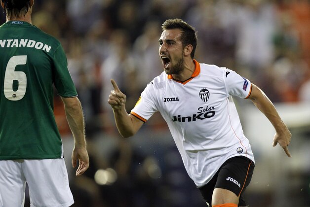 Valencia's Paco Alcacer celebrates after scoring against St Gallen during their Europa League Group A soccer match at the Mestalla stadium in Valencia, Spain, Thursday, Oct. 24, 2013. (AP Photo/Alberto Saiz)