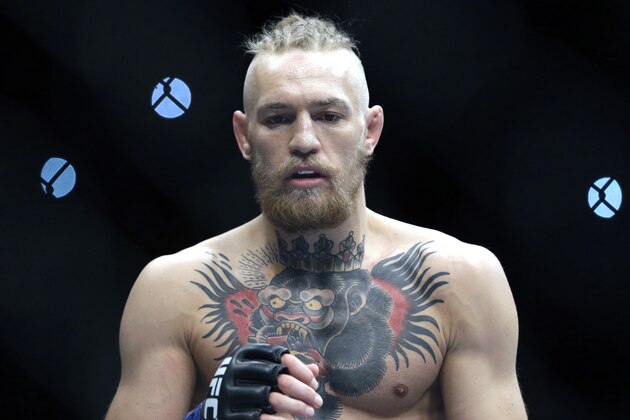 FILE - This Sept. 27, 2014,  file photo shows Conor McGregor during his fight with Dustin Poirier, in Las Vegas. McGregor has been playing elaborate mind games with Jose Aldo for many months, goading and taunting the UFC champion with verbal dexterity and showmanship to rival the greatest self-promoters in sports history. The Irish featherweight finally gets his Brazilian target in the octagon Dec. 12, at UFC 194, at MGM Grand Garden Arena in Las Vegas and McGregor promises he’ll back up every word he said. (AP Photo/John Locher, File)