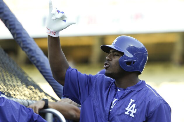 Los Angeles Dodgers right fielder Yasiel Puig watches batting practice before Game 2 of baseball's National League Division Series against the New York Mets, Saturday, Oct. 10, 2015 in Los Angeles. (AP Photo/Lenny Ignelzi)