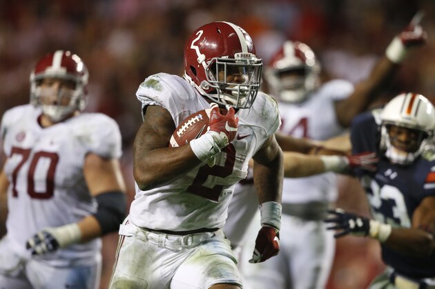 Alabama running back Derrick Henry (2) runs the ball and scores a touchdown during the second half of an NCAA college football game, Saturday, Nov. 28, 2015, in Auburn, Ala. Alabama won 29-13. (AP Photo/Gerald Herbert)
