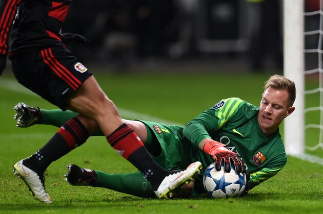 Barcelona's German goalkeeper Marc-Andre Ter Stegen in action during the Group E, second-leg UEFA Champions League football match Bayer 04 Leverkusen vs FC Barcelona in Leverkusen, western Germany on December 9, 2015. AFP PHOTO / PATRIK STOLLARZ / AFP / PATRIK STOLLARZ        (Photo credit should read PATRIK STOLLARZ/AFP/Getty Images)