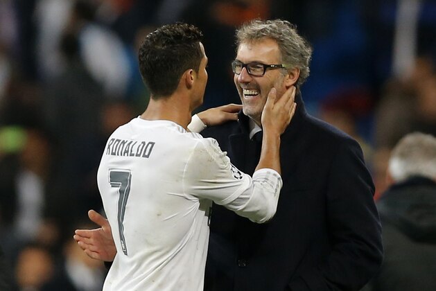 Real Madrid's Cristiano Ronaldo, left, talks with PSG headcoach Laurent Blanc after their Group stage of Champions League Group A soccer match at the Santiago Bernabeu stadium in Madrid, Spain, Tuesday, Nov.3, 2015. Ream Madridd won 1-0. (AP Photo/Daniel Ochoa de Olza)