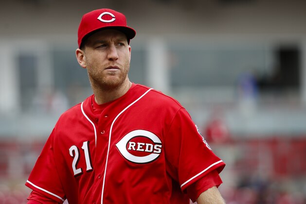 Cincinnati Reds third baseman Todd Frazier walks off the field in the ninth inning of a baseball game against the Chicago Cubs, Thursday, Oct. 1, 2015, in Cincinnati. The Cubs won 5-3. (AP Photo/John Minchillo)