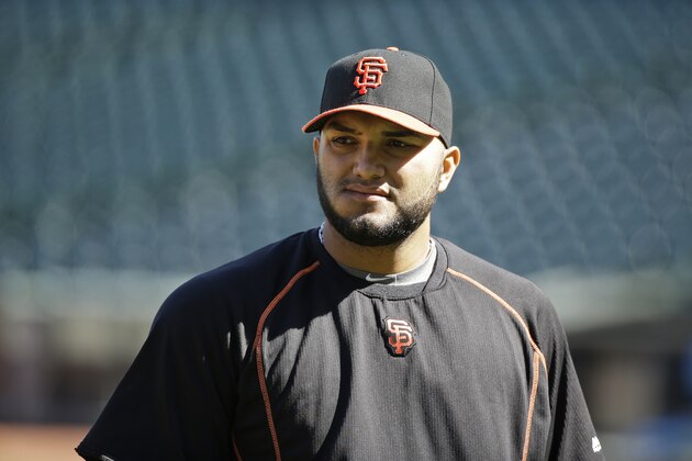 San Francisco Giants relief pitcher Yusmeiro Petit before the start of their baseball game against the San Diego Padres Tuesday, June 23, 2015, in San Francisco. (AP Photo/Eric Risberg)
