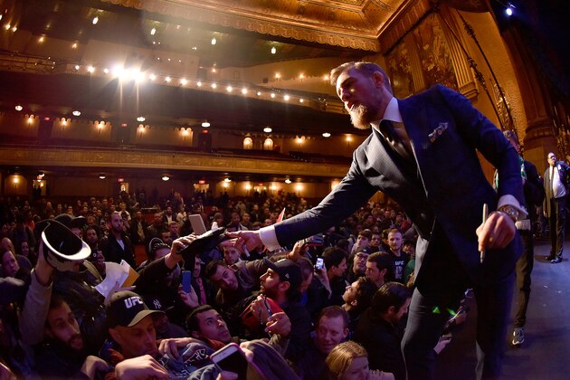 NEW YORK, NY - MARCH 26:  UFC featherweight title challenger Conor McGregor of Ireland interacts with fans during the UFC 189 World Championship Press Tour press conference inside the Beacon Theatre on March 26, 2015 in New York City. (Photo by Jeff Bottari/Zuffa LLC/Zuffa LLC via Getty Images)