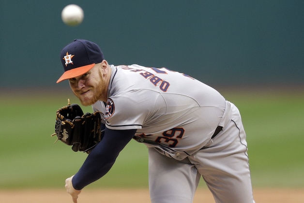 Houston Astros starting pitcher Brett Oberholtzer delivers in the first inning of a baseball game against the Cleveland Indians, Thursday, July 9, 2015, in Cleveland. (AP Photo/Tony Dejak)