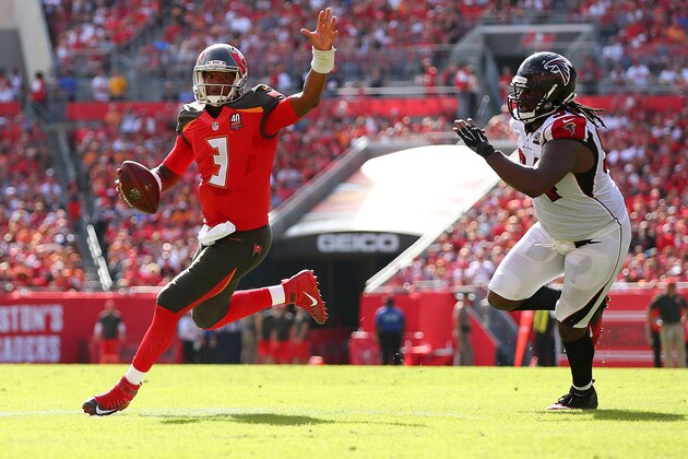 TAMPA, FL - DECEMBER 06: Jameis Winston #3 of the Tampa Bay Buccaneers runs past Tyson Jackson #94 of the Atlanta Falcons for a touchdown during the first quarter of the game at Raymond James Stadium on December 6, 2015 in Tampa, Florida.  (Photo by Rob Foldy/Getty Images)