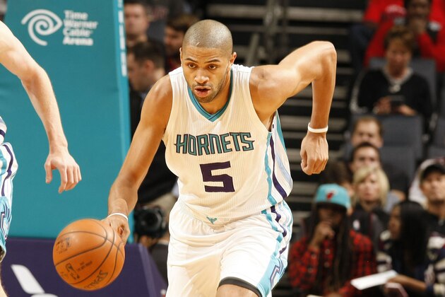 CHARLOTTE, NC - DECEMBER 9:  Nicolas Batum #5 of the Charlotte Hornets handles the ball against the Miami Heat on December 9, 2015 at Time Warner Cable Arena in Charlotte, North Carolina. NOTE TO USER: User expressly acknowledges and agrees that, by downloading and or using this photograph, User is consenting to the terms and conditions of the Getty Images License Agreement.  Mandatory Copyright Notice:  Copyright 2015 NBAE (Photo by Kent Smith/NBAE via Getty Images)