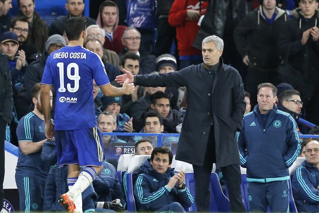 Chelsea manager Jose Mourinho, right, reaches his hand to Chelsea's Diego Costa, left, during the Champions League group G soccer match between Chelsea and FC Porto at Stamford Bridge stadium in London, Wednesday, Dec. 9, 2015.(AP Photo/Frank Augstein)