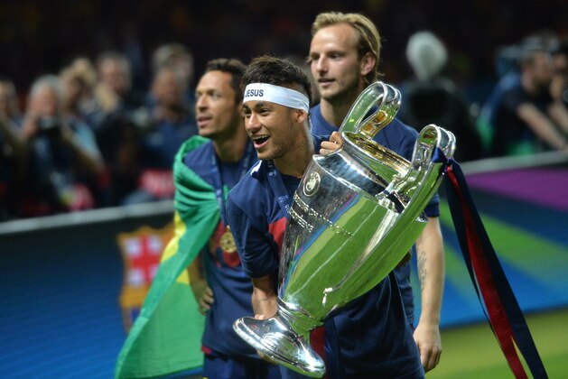 Barcelona's Brazilian forward Neymar da Silva Santos Junior celebrates after Barcelona won the UEFA Champions League Final football match between Juventus and FC Barcelona at the Olympic Stadium in Berlin on June 6, 2015.   AFP PHOTO / OLIVER LANG        (Photo credit should read OLIVER LANG/AFP/Getty Images)