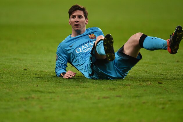 Barcelona´s Argentinian striker Lionel Messi reacts during the Group E, second-leg UEFA Champions League football match Bayer 04 Leverkusen vs FC Barcelona in Leverkusen, western Germany on December 9, 2015. AFP PHOTO / PATRIK STOLLARZ / AFP / PATRIK STOLLARZ        (Photo credit should read PATRIK STOLLARZ/AFP/Getty Images)
