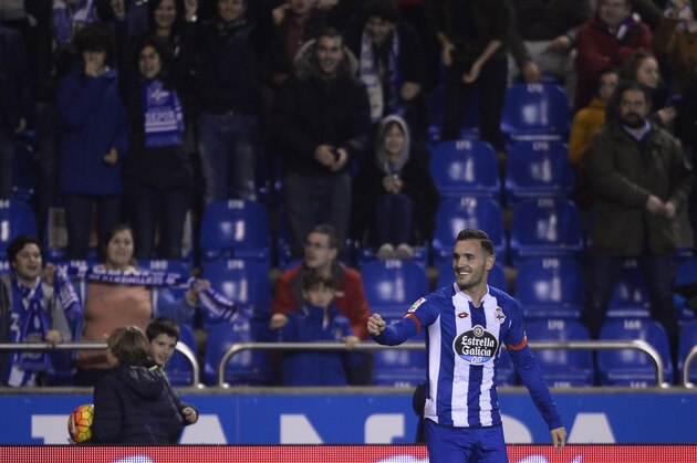 Deportivo La Coruna's midfielder Lucas Perez celebrates a goal during the Spanish league football match RC Deportivo de la Coruna vs Sevilla FC at the Municipal de Riazor stadium in La Coruna on December 5, 2015.   AFP PHOTO / MIGUEL RIOPA / AFP / MIGUEL RIOPA        (Photo credit should read MIGUEL RIOPA/AFP/Getty Images)