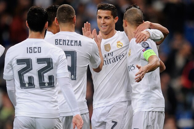 MADRID, SPAIN - DECEMBER 08:  Karim Benzema of Real Madrid celebrates with Cristiano Ronaldo after scoring Real's opening goal during the UEFA Champions League Group A match between Real Madrid CF and Malmo FF at the Santiago Bernabeu stadium on December 8, 2015 in Madrid, Spain.  (Photo by Denis Doyle/Getty Images)