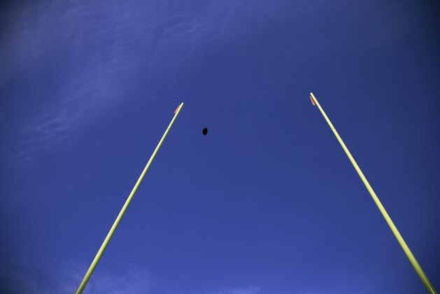 A football flies through the uprights during warm ups before an NFL football game between the Philadelphia Eagles and the Tennessee Titans, Sunday, Nov. 23, 2014, in Philadelphia. (AP Photo/Michael Perez)