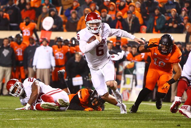 Nov 28, 2015; Stillwater, OK, USA; Oklahoma Sooners quarterback Baker Mayfield (6) runs the ball for a touchdown against the Oklahoma State Cowboys at Boone Pickens Stadium. The Sooners defeated the Cowboys 58-23. Mandatory Credit: Mark J. Rebilas-USA TODAY Sports Nov 28, 2015; Stillwater, OK, USA; Oklahoma Sooners quarterback Baker Mayfield (6) runs the ball for a touchdown against the Oklahoma State Cowboys at Boone Pickens Stadium. The Sooners defeated the Cowboys 58-23. Mandatory Credit: Mark J. Rebilas-USA TODAY Sports