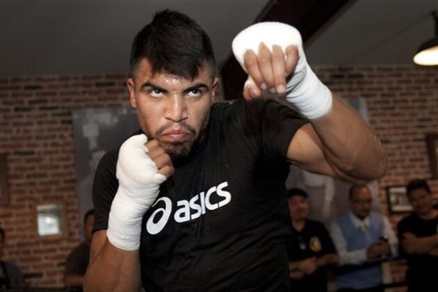 FILE - This June 20, 2012 file photo shows boxer Victor Ortiz training during the media workout at Fortune Boxing Gym in Los Angeles. Ortiz  is one of eleven celebrity contestants who will compete on the next edition of