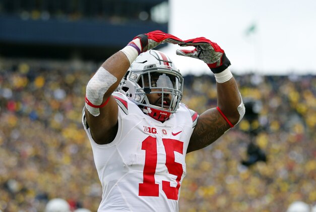 Nov 28, 2015; Ann Arbor, MI, USA; Ohio State Buckeyes running back Ezekiel Elliott (15) celebrates a touchdown in the first quarter against the Michigan Wolverines at Michigan Stadium. Mandatory Credit: Rick Osentoski-USA TODAY Sports