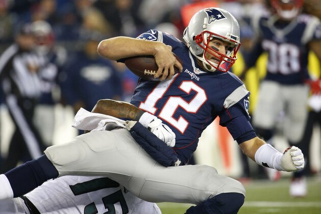 New England Patriots quarterback Tom Brady is taken down during a NFL football game against the Philadelphia Eagles at Gillette Stadium in Foxborough, Mass.Sunday, Dec. 6, 2015. (Winslow Townson/AP Images for Panini)