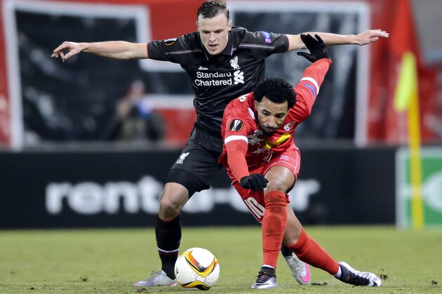 Liverpool's Australian defender Brad Smith (L) and Sion's Portugese midfielder Carlitos vie for the ball during the UEFA Europa League group B football match between FC Sion and FC Liverpool at the Tourbillon stadium in Sion on December 10, 2015.  / AFP / FABRICE COFFRINI        (Photo credit should read FABRICE COFFRINI/AFP/Getty Images)