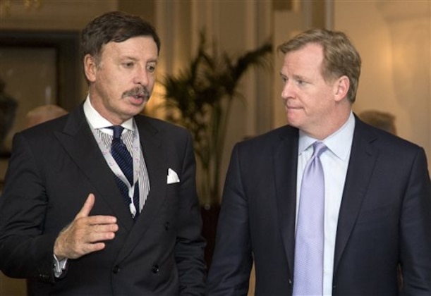 FILE - In this Oct. 8, 2013, file photo, Stan Kroenke, owner of the St. Louis Rams football team, left, talks with NFL Commissioner Roger Goodell during a break in the NFL fall meeting in Washington. A newspaper reports the owner of the Rams plans to build an NFL stadium in Los Angeles County, boosting the chances that pro football could return to the region. The Los Angeles Times says Kroenke has partnered with Stockbridge Capital Group, owners of the 238-acre Hollywood Park site in Inglewood. (AP Photo/Carolyn Kaster, File)