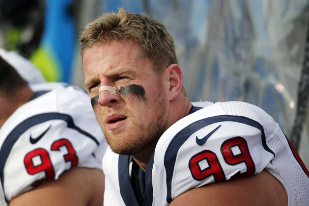 Houston Texans defensive end J.J. Watt looks on from the bench during the first half of an NFL football game against the Buffalo Bills, Sunday, Dec. 6, 2015, in Orchard Park, N.Y. (AP Photo/Bill Wippert)