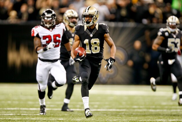 Dec 21, 2014; New Orleans, LA, USA; New Orleans Saints wide receiver Jalen Saunders (18) returns the opening kickoff as Atlanta Falcons strong safety Kemal Ishmael (36) chases during the first quarter at the Mercedes-Benz Superdome. Mandatory Credit: Derick E. Hingle-USA TODAY Sports