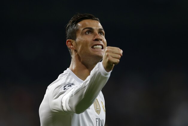 Real Madrid’s Cristiano Ronaldo celebrates scoring his side's 4th goal during a Champions League group A soccer match between Real Madrid and Malmo at the Santiago Bernabeu stadium in Madrid, Tuesday, Dec. 8, 2015. (AP Photo/Francisco Seco)