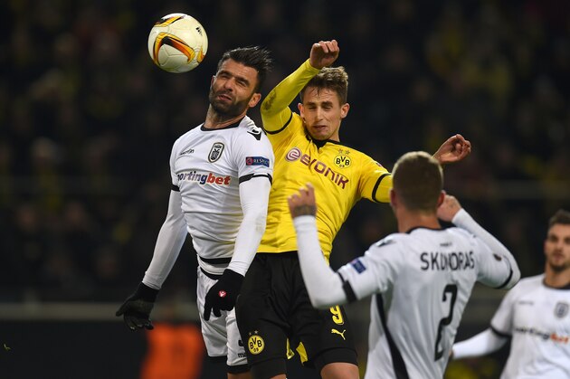 Dortmund's midfielder Adnan Januzaj (C) vies with PAOK´s Giorgos Tzavellas during the UEFA Europa League football match between Borussia Dortmund and PAOK FC at BVB Stadion Dortmund in Dortmund on December 10, 2015.  AFP PHOTO / PATRIK STOLLARZ / AFP / PATRIK STOLLARZ        (Photo credit should read PATRIK STOLLARZ/AFP/Getty Images)
