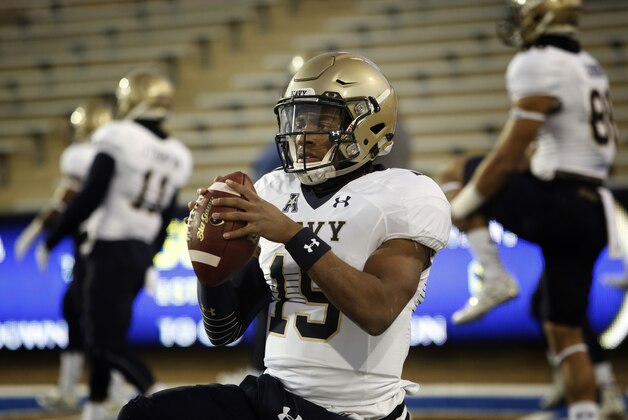 Navy quarterback Keenan Reynolds (19) warms up before facing Tulsa in an NCAA college football game in Tulsa, Okla., Saturday, Nov. 21, 2015. Navy defeated Tulsa 44-21.  (AP Photo/Brett Deering)