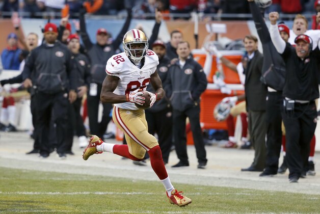 San Francisco 49ers wide receiver Torrey Smith (82) runs to there end zone for a game winning touchdown against the Chicago Bearsduring the overtime of an NFL football game, Sunday, Dec. 6, 2015, in Chicago. The 49ers won 26-20. (AP Photo/Charles Rex Arbogast)