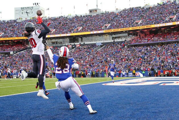 Houston Texans wide receiver DeAndre Hopkins (10) goes up for a touchdown catch on a pass from quarterback Brian Hoyer, not pictured, as Buffalo Bills cornerback Ronald Darby (28) defends during the second half of an NFL football game, Sunday, Dec. 6, 2015, in Orchard Park, N.Y. (AP Photo/Bill Wippert)