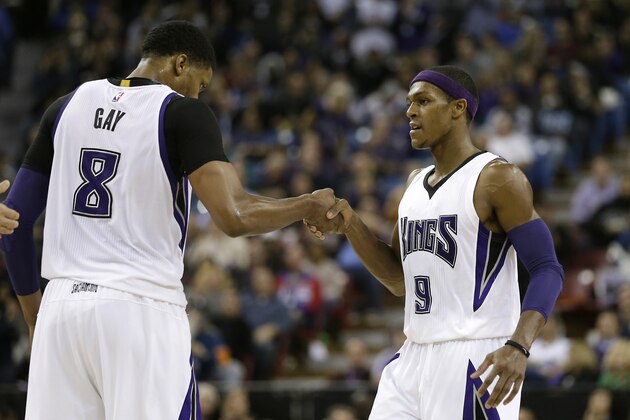 Sacramento Kings forward Rudy Gay, left, congratulates teammate Rajon Rondo, after he scored during the second half of an NBA basketball game against the Utah Jazz in Sacramento, Calif., Tuesday, Dec. 8, 2015.  The Kings won 114-106. (AP Photo/Rich Pedroncelli)