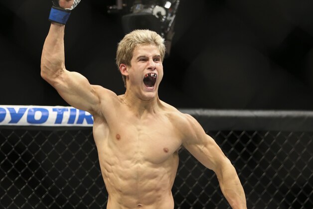 Oct 3, 2015; Houston, TX, USA; Sage Northcutt (blue gloves) celebrates after winning his bout against Francisco Trevino (not pictured) during UFC 192 at Toyota Center. Mandatory Credit: Troy Taormina-USA TODAY Sports