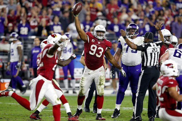 Arizona Cardinals defensive end Calais Campbell (93) holds up the football after a fumble recovery for the win against the Minnesota Vikings during the second half of an NFL football game, Thursday, Dec. 10, 2015, in Glendale, Ariz. The Cardinals won 23-20. (AP Photo/Rick Scuteri)