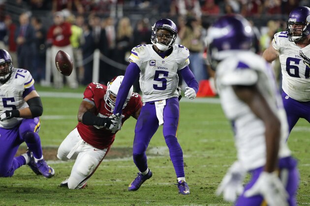 Arizona Cardinals inside linebacker Dwight Freeney (54) forces Minnesota Vikings quarterback Teddy Bridgewater (5) to fumble during the second half of an NFL football game, Thursday, Dec. 10, 2015, in Glendale, Ariz. The Cardinals recovered the ball to secure the 23-20 win. (AP Photo/Ross D. Franklin)