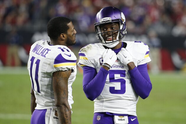 Minnesota Vikings quarterback Teddy Bridgewater (5) talks with Minnesota Vikings wide receiver Mike Wallace (11) during the second half of an NFL football game against the Arizona Cardinals, Thursday, Dec. 10, 2015, in Glendale, Ariz. (AP Photo/Ross D. Franklin)