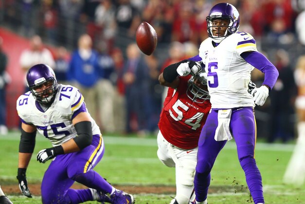 Dec 10, 2015; Glendale, AZ, USA; Arizona Cardinals linebacker Dwight Freeney (54) forces a fumble on Minnesota Vikings quarterback Teddy Bridgewater (5) in the fourth quarter at University of Phoenix Stadium. Mandatory Credit: Mark J. Rebilas-USA TODAY Sports
