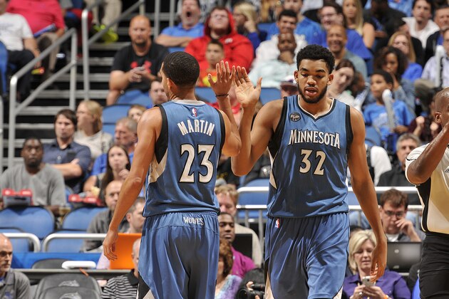 ORLANDO, FL - NOVEMBER 18:  Karl-Anthony Towns #32 of the Minnesota Timberwolves shakes hands with Kevin Martin #23 of the Minnesota Timberwolves during the game against the Orlando Magic on November 18, 2015 at Amway Center in Orlando, Florida. NOTE TO USER: User expressly acknowledges and agrees that, by downloading and or using this photograph, User is consenting to the terms and conditions of the Getty Images License Agreement. Mandatory Copyright Notice: Copyright 2015 NBAE (Photo by Fernando Medina/NBAE via Getty Images)