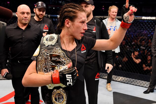 MELBOURNE, AUSTRALIA - NOVEMBER 15:  Joanna Jedrzejczyk celebrates her championship win by Unanimous Decision after five rounds against Valerie Letourneau (not pictured) in their UFC women's strawweight championship bout during the UFC 193 event at Etihad Stadium on November 15, 2015 in Melbourne, Australia.  (Photo by Josh Hedges/Zuffa LLC/Zuffa LLC via Getty Images)